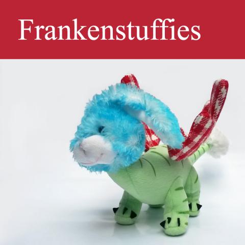 stuffed toy with the body of a dinosaur, the head and tail-tip of a bunny, and red gingham wings