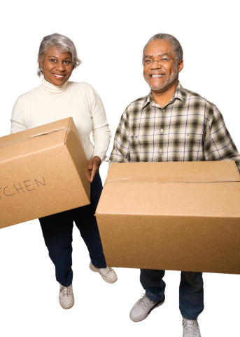 senior couple holding boxes 