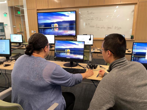 image of learner and instructor at a computer 