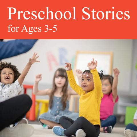 preschool-age children sitting on the floor of a classroom and raising their hands