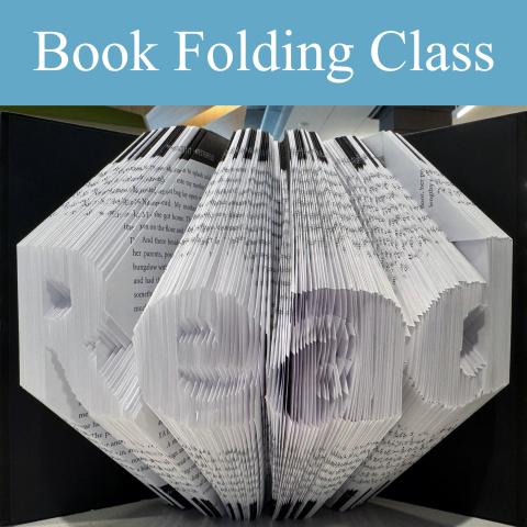 image of book with pages folded so they display the word "read"