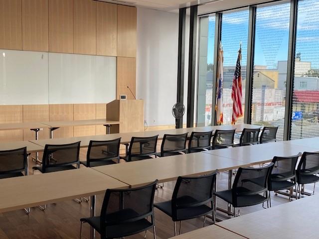 Room A setup classroom-style with rectangular tables and chairs