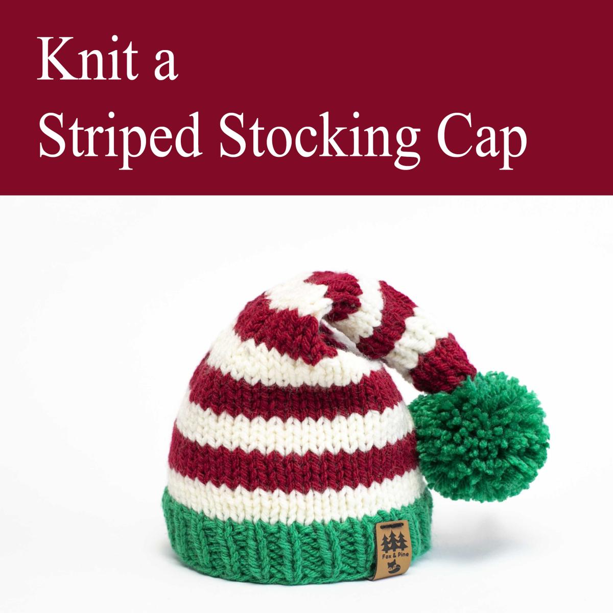 striped stocking cap in red, white, and green with a green pom-pom