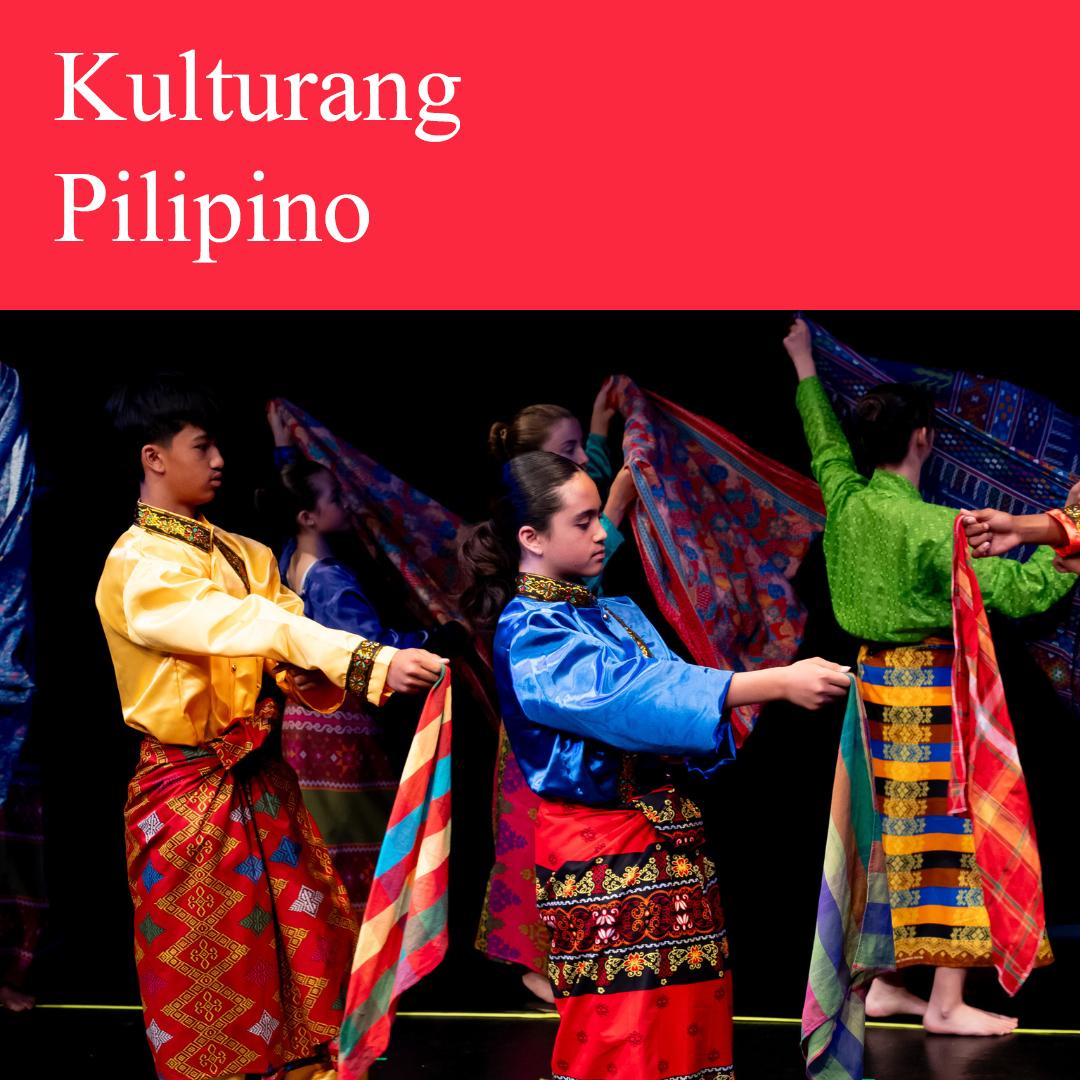 Filipino dancers on a stage wearing various and vibrant traditional garments called Malong.
